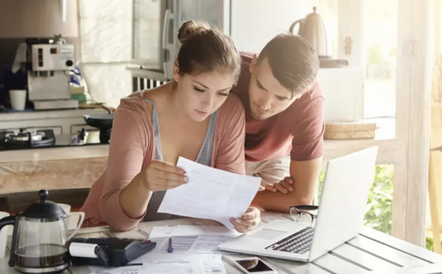 couple reading a document